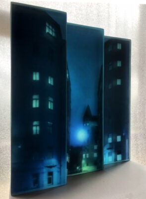 a 3d layered glass trptych artwork portraying a noir urban landscape deep in the heart of the city. Shadowy buildings, glowing streetlights and windows rendered in stacked transluscent layers of glass, creating depth, mystery and cinematic atmosphere