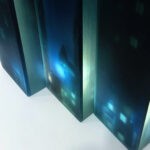 a 3d layered glass trptych artwork portraying a noir urban landscape deep in the heart of the city. Shadowy buildings, glowing streetlights and windows rendered in stacked transluscent layers of glass, creating depth, mystery and cinematic atmosphere