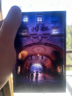 Magical twilight blue glass piece depicting a crisp winter evening in the city, set within layers of transluscent glass